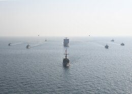 161019-N-XP344-414 ARABIAN GULF (Oct. 19, 2016) U.S. Navy mine countermeasures (MCM) ships USS Devastator (MCM 6), USS Gladiator (MCM 11) and USS Dextrous (MCM 13) steam in formation with Royal navy ships RFA Lyme Bay (L 3007), HMS Middleton (M34), HMS Chiddingfold (M37), HMS Penzance (M106) and HMS Bangor (M109) with two MH-53 helicopters from HM-15 Detachment Two during U.S.-UK Mine Countermeasures Exercise 17-1. The bilateral exercise serves to enhance cooperation, mutual MCM capabilities and interoperability between the U.S. and UK Naval forces in ensuring free flow of commerce, freedom of navigation and long-term regional security. 