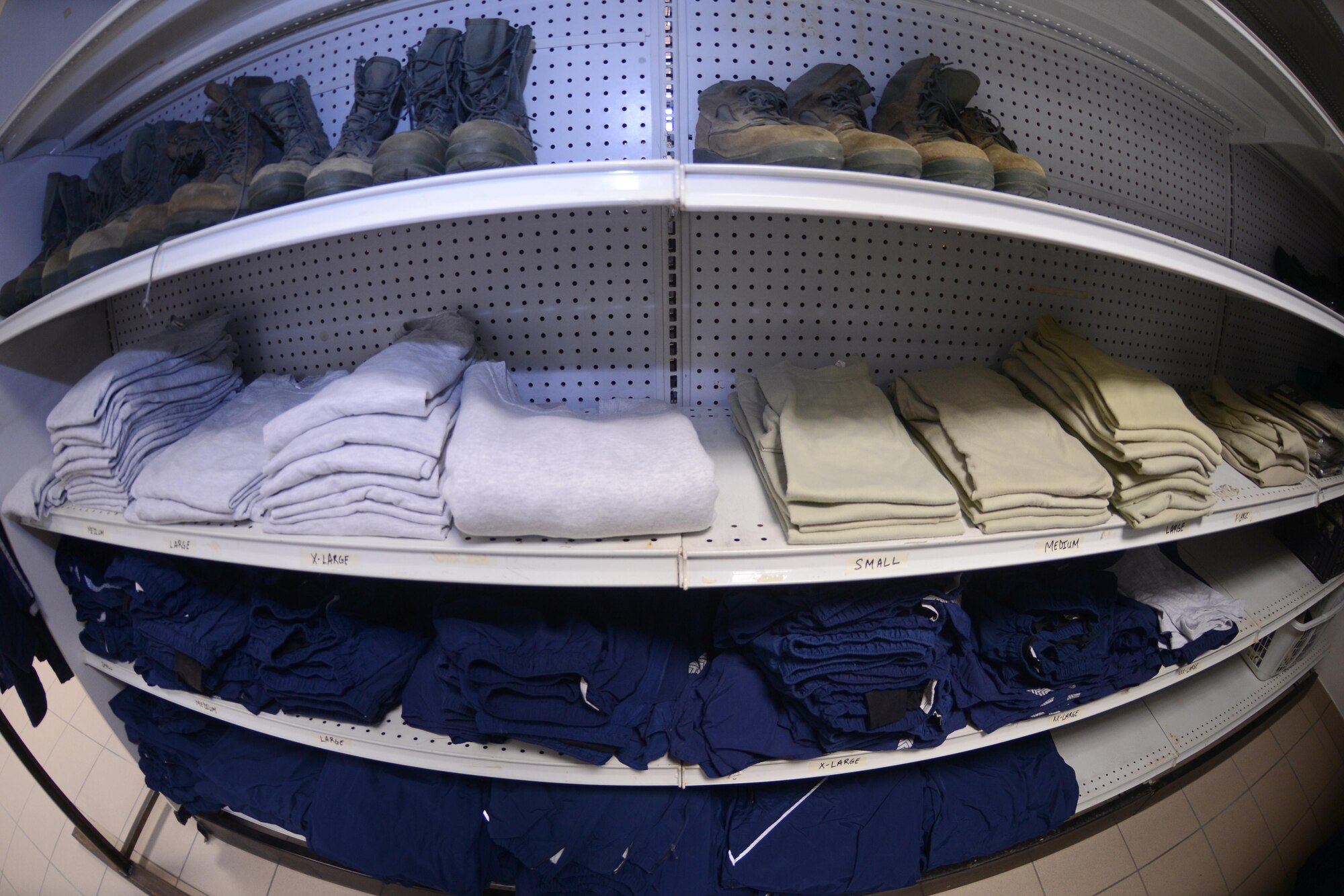 Air Force uniform items sit on a shelf in the Airman’s Attic at Aviano Air Base, Italy on Oct. 19, 2016. The Airman’s Attic supports military members E-5 and below and their family members with a variety of household goods and clothing items with the exception of uniform items which are available for all ranks. (U.S. Air Force photo by Staff Sgt. Andrew M. Satran/Released)