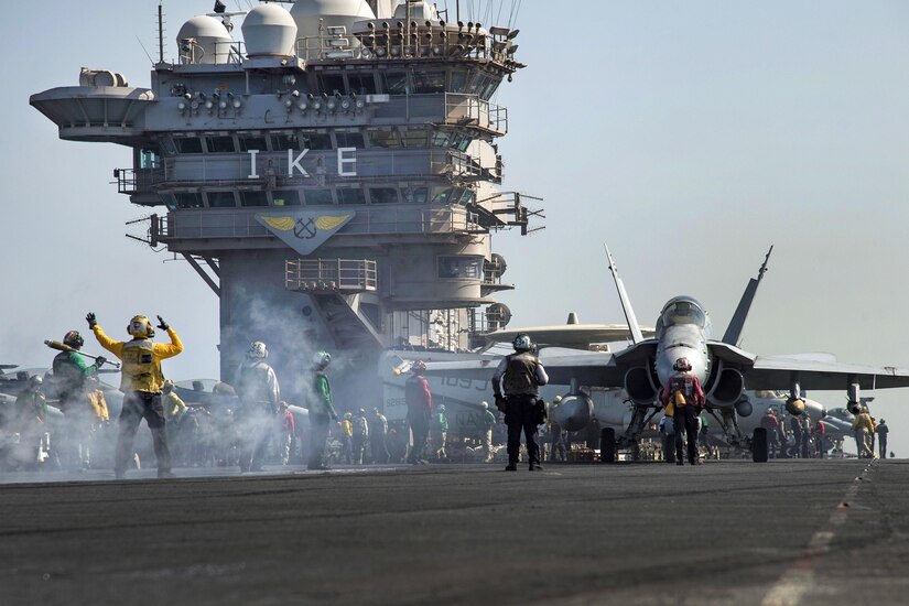 An F/A-18C Hornet aircraft taxis toward a bow catapult on the flight deck of the aircraft carrier USS Dwight D. Eisenhower in the Persian Gulf, Oct. 16, 2016. The pilots and aircraft are assigned to Strike Fighter Squadron 131. The Eisenhower and its Carrier Strike Group are deployed in support of Operation Inherent Resolve, maritime security operations and theater security cooperation efforts in the U.S. 5th Fleet area of operations. Navy photo by Seaman Christopher A. Michaels