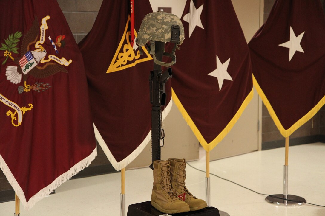 A display of a kevlar, rifle, I.D. tags and boots are placed as a memorial in honor of Master Sgt. Graham, Oct. 15, 2016.  Photo captured by Maj. Satomi Mack-Martin.