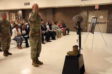 3d MCDS Chief of Staff, Col. Michael Pullen renders a final salute during the memorial ceremony held in honor of Master Sgt. Steven Graham, Oct. 15, 2016.  Photo captured by Maj. Satomi Mack-Martin.