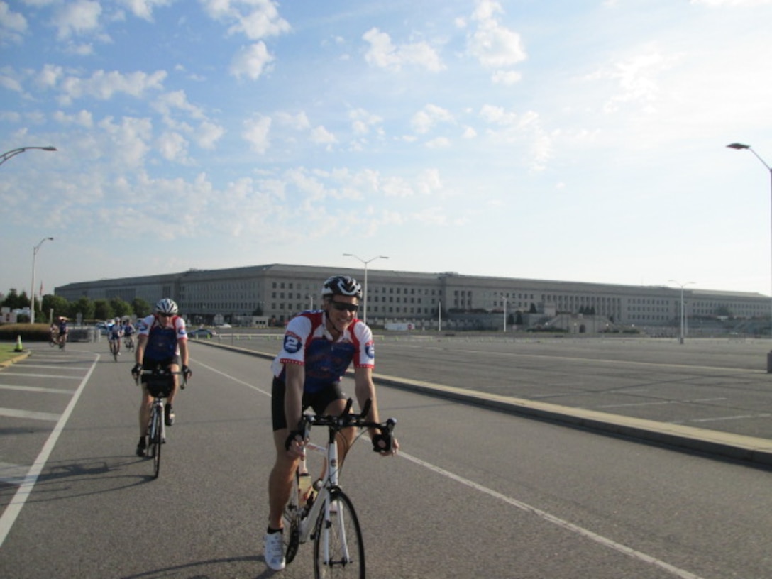 Defense Contract Management Agency employees Edward Saunders and Edward Lowden ride past the Pentagon during the Ride 2 Recovery Honor Ride to support their fellow veterans, which is a 60-mile cycling event in Washington, D.C., Sept. 10. (Photo courtesy of Edward Lowden)


