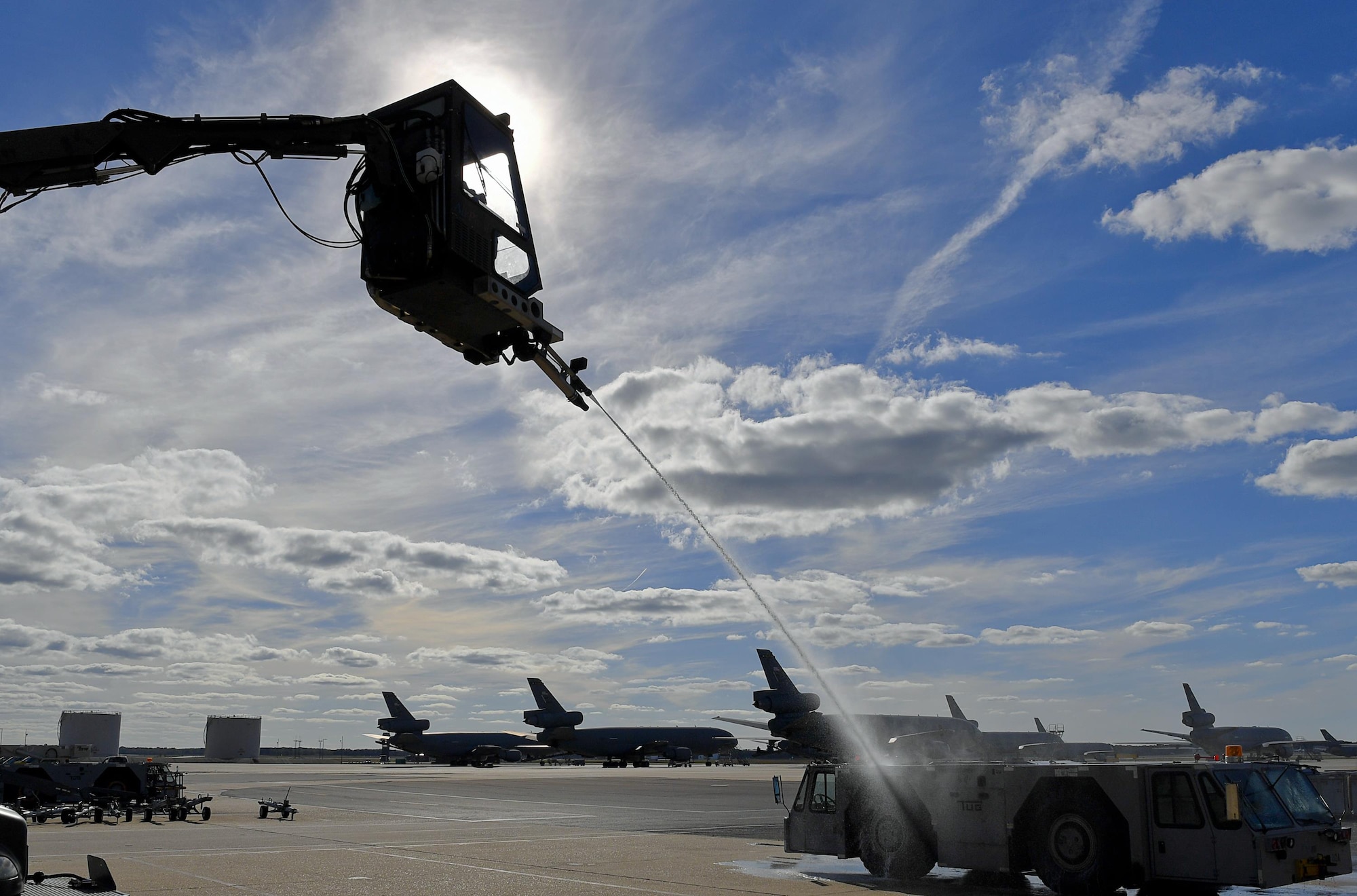 Lt. Gen. Sam Cox, 18th Air Force commander learns How to operate the bucket of a global deicing truck during his visit to the 605th Aircraft Maintenance Squadron Oct. 12. The bucket operator controls the deicing nozzle, which uses a combination of hot air and Type 1 deicing fluid to force ice off aircraft. (U.S. Air Force photo by Christian DeLuca/released)