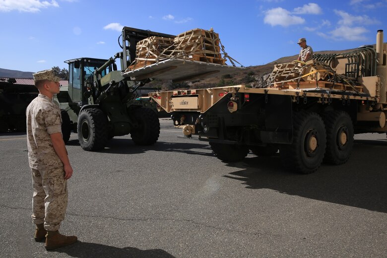 U.S. Marines from Combat Logistics Regiment 15 properly place pallets, filled with the M-88A2’s armored side skirts and front winch at Camp Pendleton, Calif., Oct. 3, 2016. The pieces were removed from the M-88A2 HERCULES to the reduce risk of parts coming loose and causing a safety hazard during the flight to Marine Corps Air Ground Combat Center Twentynine Palms, Calif.