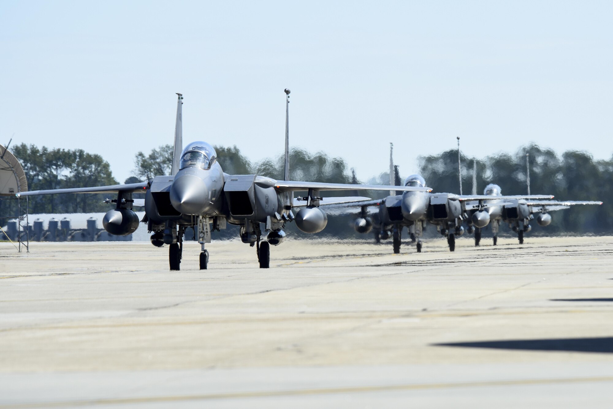 Three F-15E Strikes Eagles, from the 335th Fighter Squadron, return from deployment, Oct. 12, 2016, at Seymour Johnson Air Force Base, North Carolina. More than 10 aircraft returned from an undisclosed location in Southwest Asia where they provided support for OPERATION INHERENT RESOLVE. (U.S. Air Force photo by Airman Shawna L. Keyes)