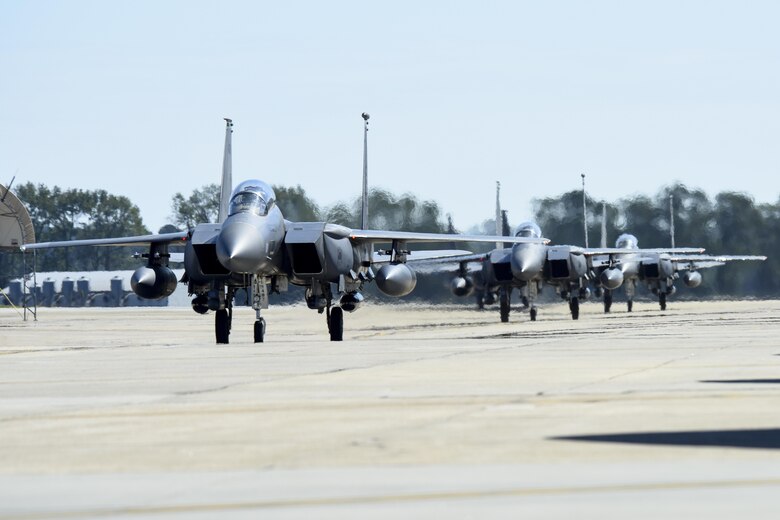 Three F-15E Strikes Eagles, from the 335th Fighter Squadron, return from deployment, Oct. 12, 2016, at Seymour Johnson Air Force Base, North Carolina. More than 10 aircraft returned from an undisclosed location in Southwest Asia where they provided support for OPERATION INHERENT RESOLVE. (U.S. Air Force photo by Airman Shawna L. Keyes)