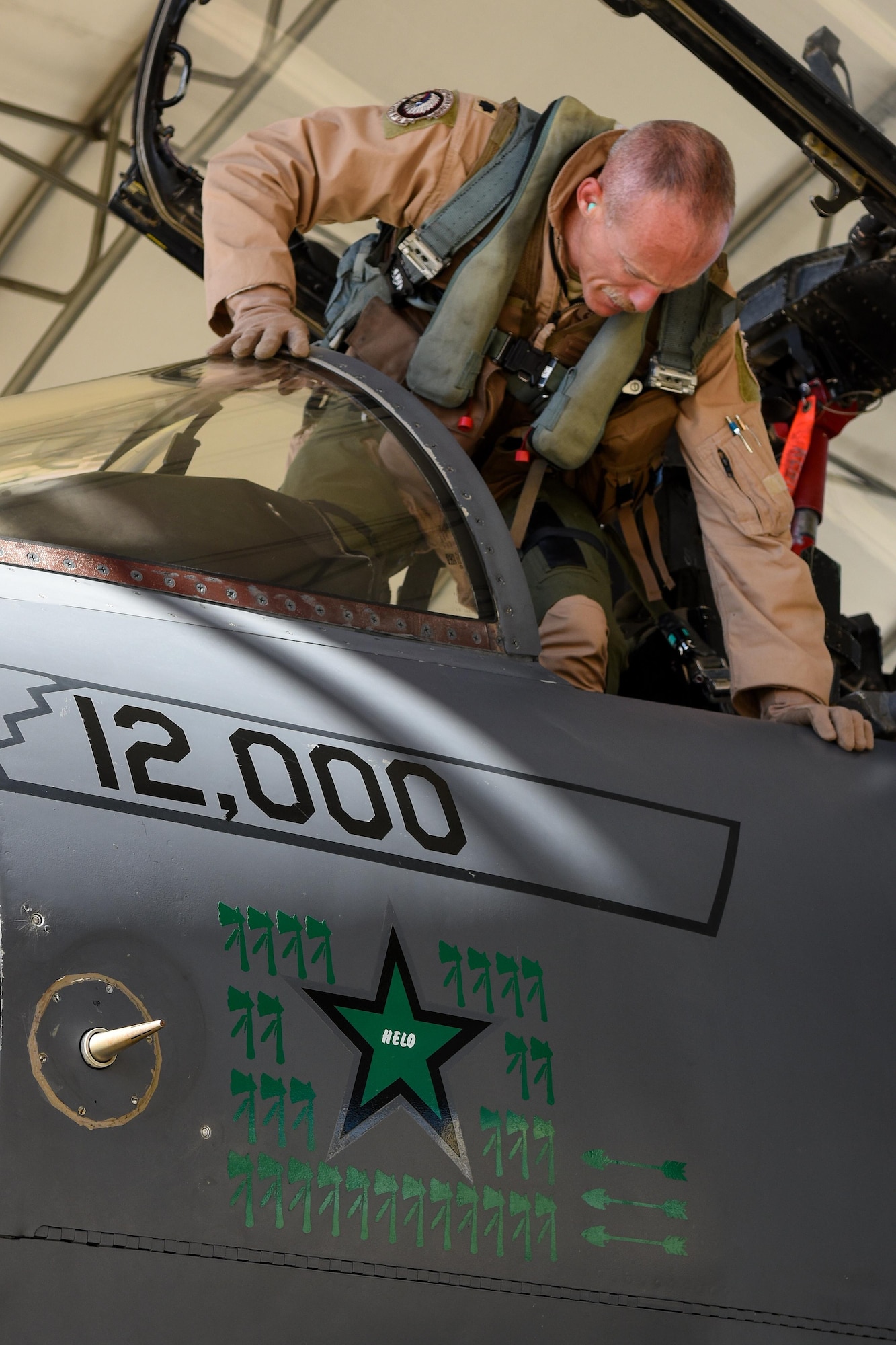 Lt Col. Brandon Johnson, 335th Fighter Squadron commander, disembarks an F-15E Strike Eagle after returning from deployment, Oct. 12, 2016, at Seymour Johnson Air Force Base, North Carolina. During the deployment, Johnson’s aircraft reached its 12,000 flight hour milestone on Aug. 16, while Johnson also recorded his 3,000th flight hour during the same sortie. (U.S. Air Force photo by Airman Shawna L. Keyes)