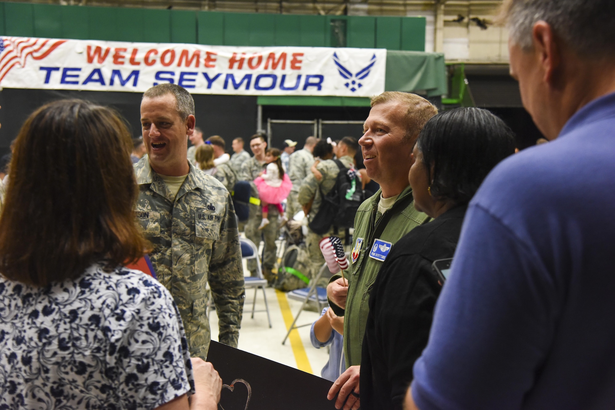 Members of Team Seymour greet Airmen during a redeployment ceremony Oct. 17, 2016, at Seymour Johnson Air Force Base, North Carolina. More than 200 friends and family awaited the arrival of the Airmen following their return from deployment to an undisclosed location in Southwest Asia. (U.S. Air Force photo by Airman 1st Class Kenneth Boyton) 