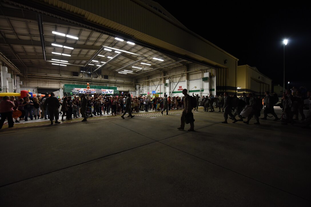More than 200 friends and family greeted Airmen who recently returned from deployment Oct. 17, 2016, at Seymour Johnson Air Force Base, North Carolina. More than 300 Airmen from the 4th Maintenance Group and 335th Fighter Squadron were met with cheers from loved ones upon their arrival. (U.S. Air Force photo by Airman Shawna L. Keyes)