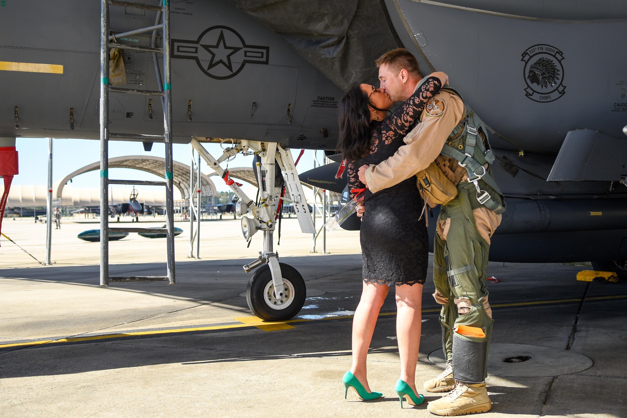 Capt. Bernard Froehlich (right), 335th Fighter Squadron weapons system officer, embraces his girlfriend Melissa Weinblatt, Oct. 12, 2016, at Seymour Johnson Air Force Base, North Carolina. After their embrace, Froehlich proposed to Weinblatt. (U.S. Air Force photo by Airman Shawna L. Keyes)