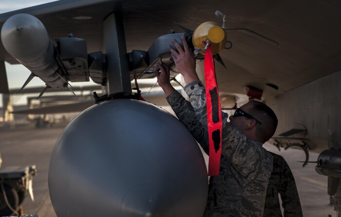Staff Sgt. Johnathan Fulbright, 757th Aircraft Maintenance Squadron, loads munitions onto an F-15 Eagle during the 57th Wing’s third quarter weapons load crew competition at Nellis Air Force Base, Nev., Oct. 7. The competition provides weapons loaders throughout the 57th Maintenance Group the opportunity to display their warfighting skills to their peers and superiors.(U.S. Air Force photo by Airman 1st Class Kevin Tanenbaum/Released)