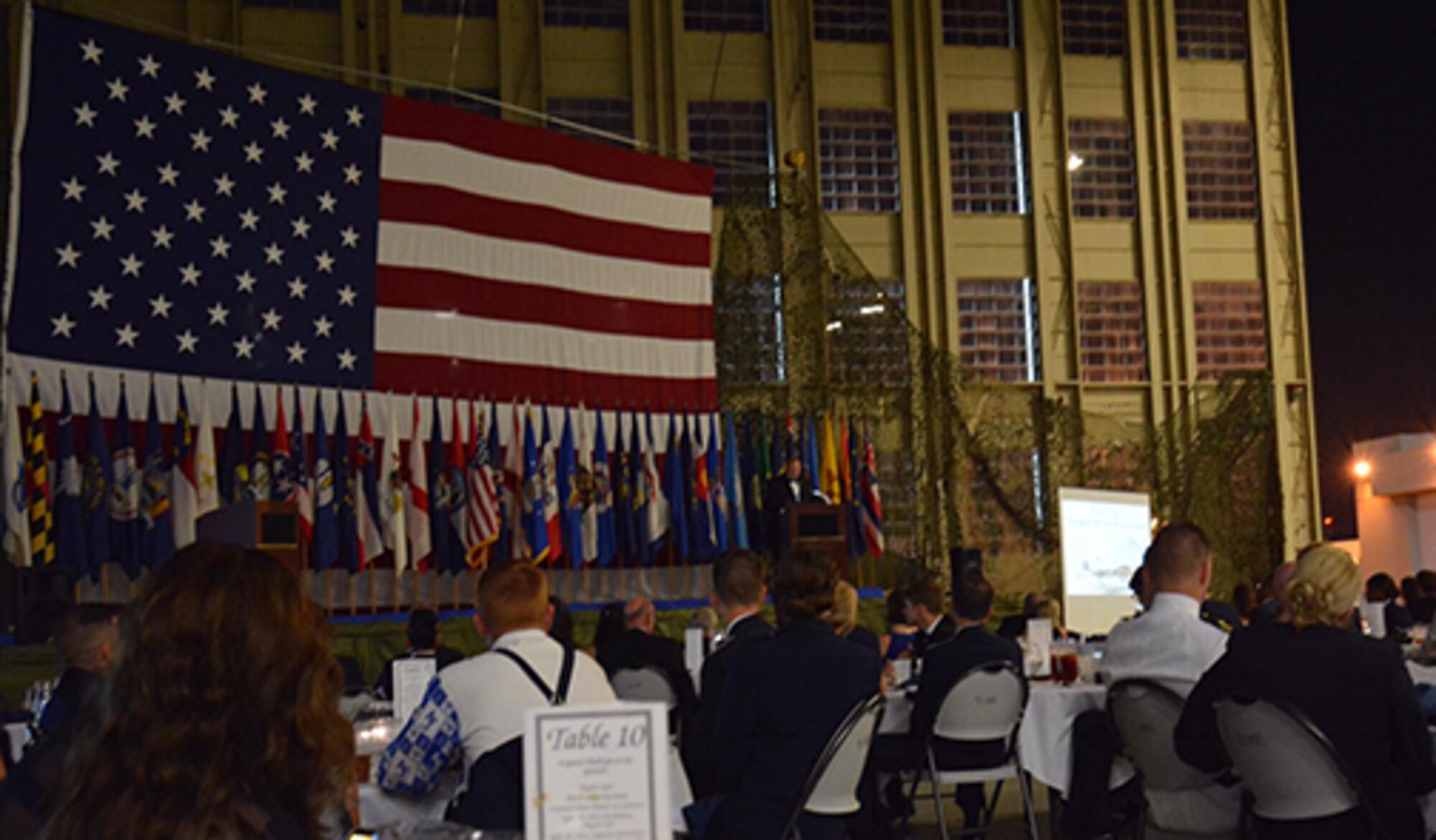 Retired U.S. Air Force Gen. Philip Breedlove, former supreme commander of NATO forces in Europe, addresses service members during the Air Force Ball held in historic King Hangar Oct. 15 Eglin Air Force Base, Florida. The event, hosted by the 96th Test Wing, was organized by a committee comprised of the Company Grade Officers Council and First Sergeants Association. More than 600 service members shared the hangar with an F-15, F-35, A-10, and AC-130W aircraft and a weapons display. (U.S. Air Force Photo/Linda Phillips)