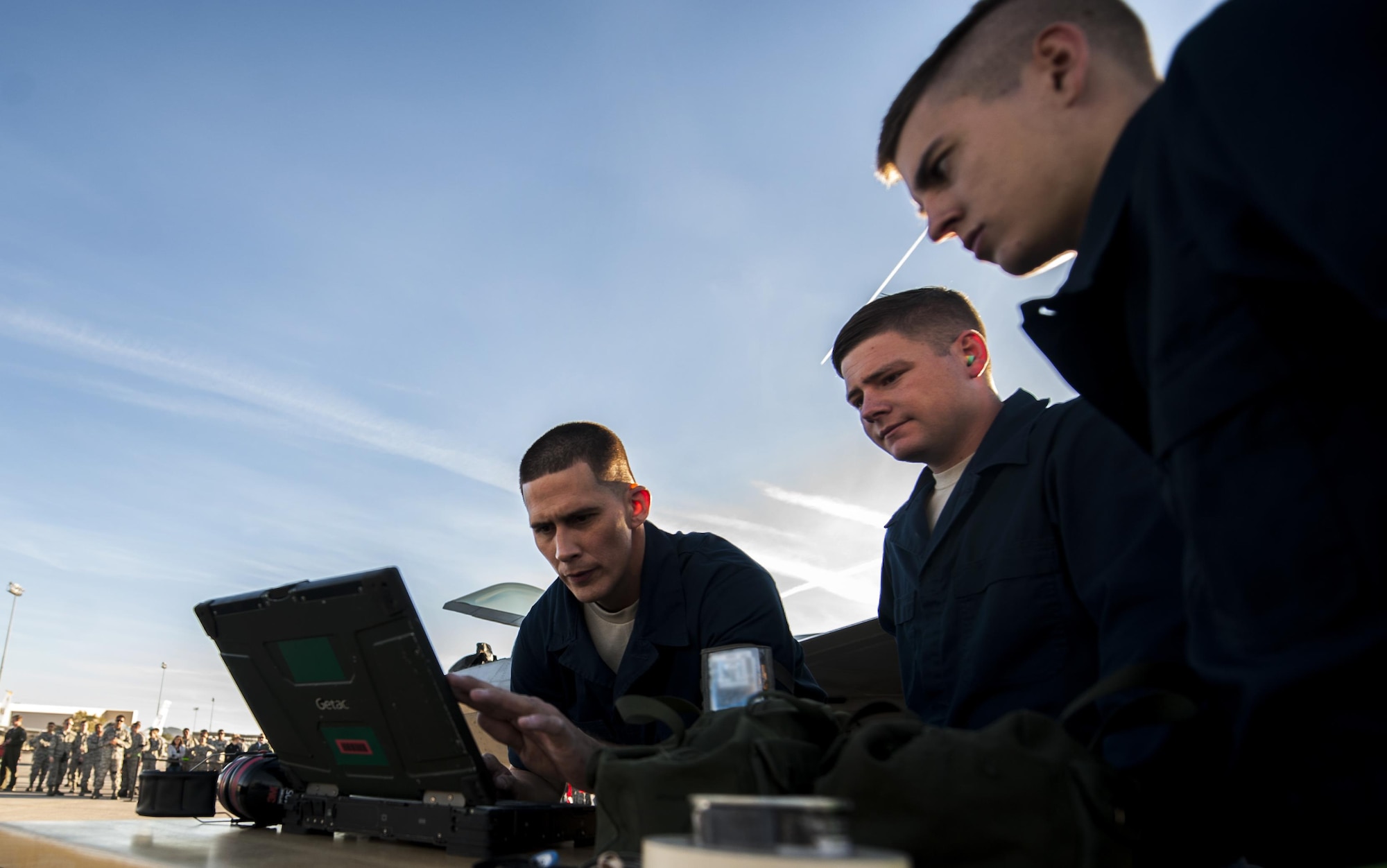 Airmen from the Raptor Aircraft Maintenance Unit look over
their checklist to load an F-22 Raptor during the 57th Wing’s third quarter weapons load crew competition at Nellis Air Force Base, Nev., Oct. 7. Raptor AMU is responsible for the maintenance of the F-22s on Nellis AFB.(U.S. Air Force photo by Airman 1st Class Kevin Tanenbaum/Released)