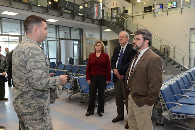Air Force Lt. Col. Chad Annunziata, 726th Air Mobility Squadron commander, talks to John Conger, Peter Potochney and Allison Sands about the capabilities of the squadron during a site visit by the Defense Department officials to Spangdahlem Air Base, Germany, Feb. 28, 2014. Air Force photo by Airman 1st Class Kyle Gese