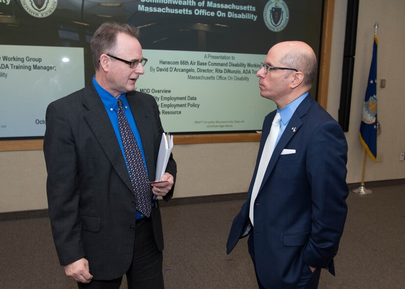 Steve LaFleur, left, Hanscom's Disability Employment Program manager, speaks to David D’Arcangelo, Massachusetts Office on Disability director, before the start of a National Disability Employment Awareness Month discussion at Hanscom Air Force Base, Mass., Oct. 18. The event was held as part of NDEAM that is celebrated each October to educate people on disability employment as well as to recognize the contributions of those employees. (U.S. Air Force photo by Jerry Saslav)