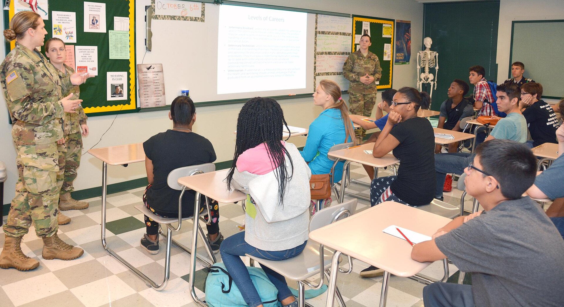 (From left) Staff Sgt. Devon Modrak animal care specialist, Capt. Daniela Roberts, veterinarian, and Sgt. Robyn Rothwell, animal care specialist, speak to a room of Cole High School Students during the school’s career day Oct. 7. The event hosted both civilian and military career professionals who spoke on occupations such biochemistry, nursing, legal, veterinary science and engineering.
