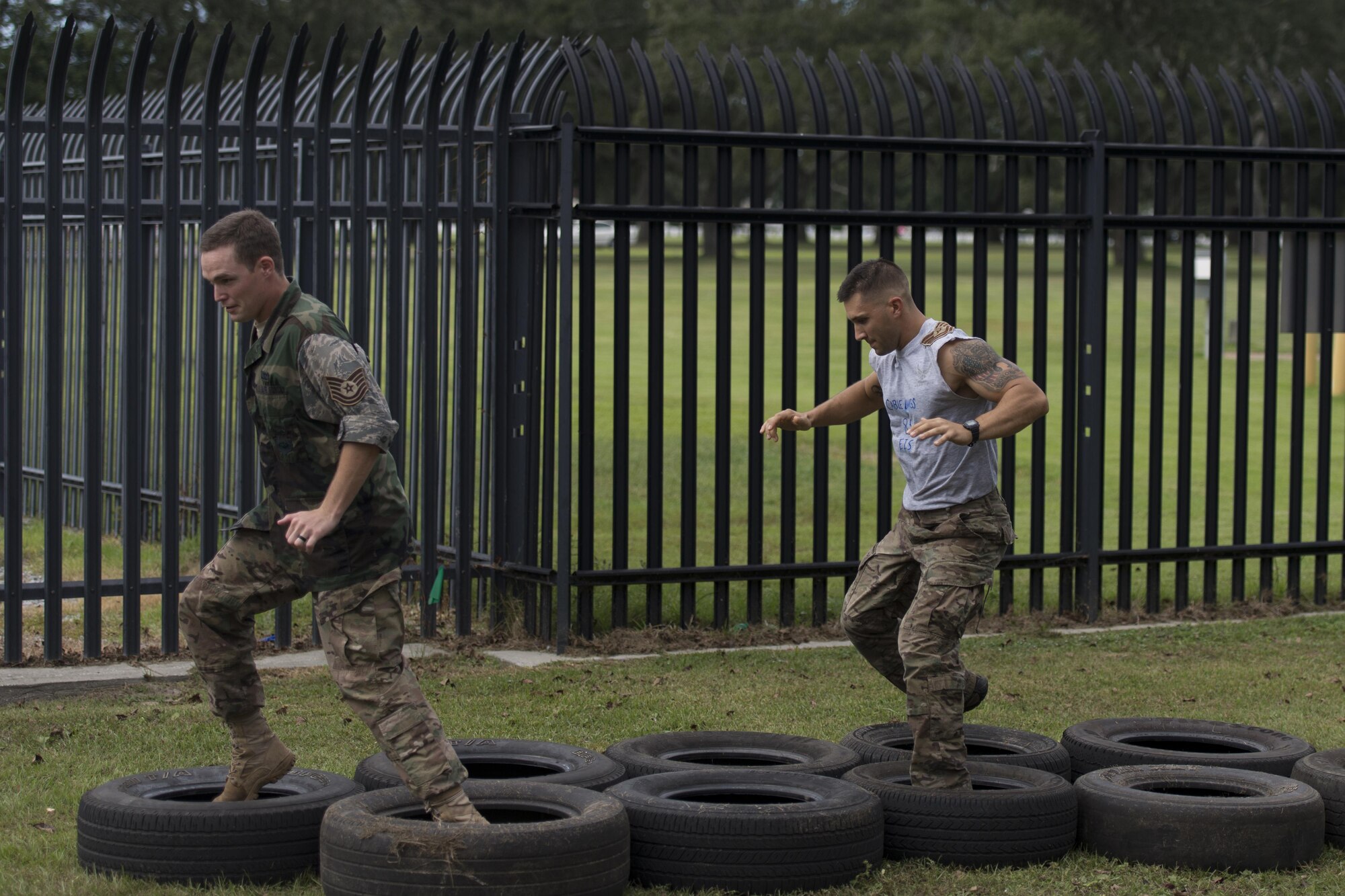 Tech. Sgt. Jamie Felkins and Staff Sgt. Tyler Crawford, 85th Engineering Installation Squadron cable and antenna maintainers, negotiate a tire obstacle course during the 85th EIS Combat Dining In at the 85th EIS compound Oct 7, 2016, on Keesler Air Force Base, Miss. The combat dining-in is a military tradition which promotes good fellowship and esprit de corps throughout the unit. (U.S. Air Force photo by Andre’ Askew/Released)

