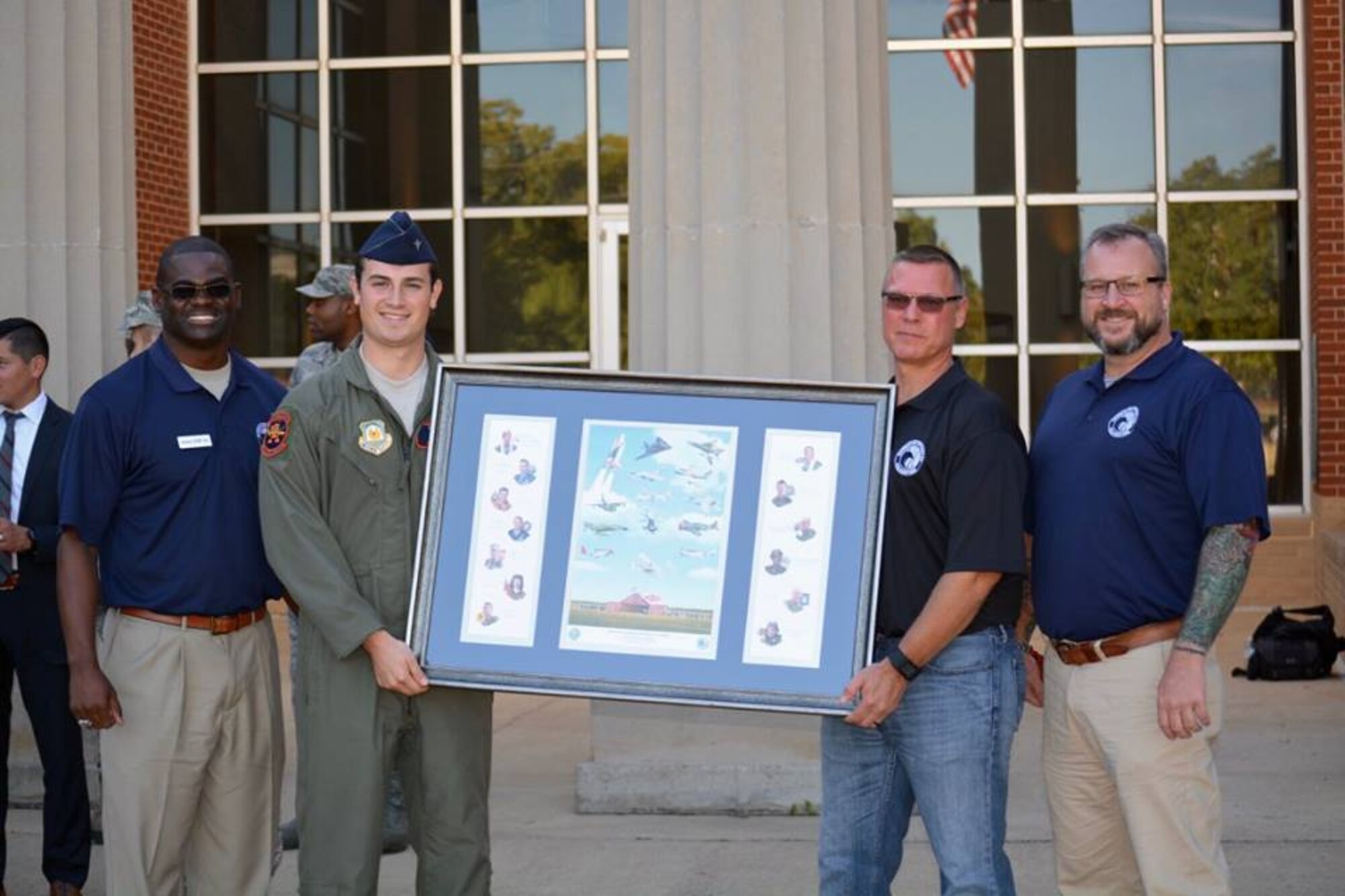 Students and faculty from ACSC traveled to Auburn University’s AFROTC detachment to participate in the detachment’s career day Oct. 13th.  After talking with cadets about career opportunities in the Air Force, the Gathering of Eagles Foundation presented the detachment with a lithograph of previous Eagles who made lasting contributions to air power.  (U.S. Air Force photo by Maj. Will Powell)