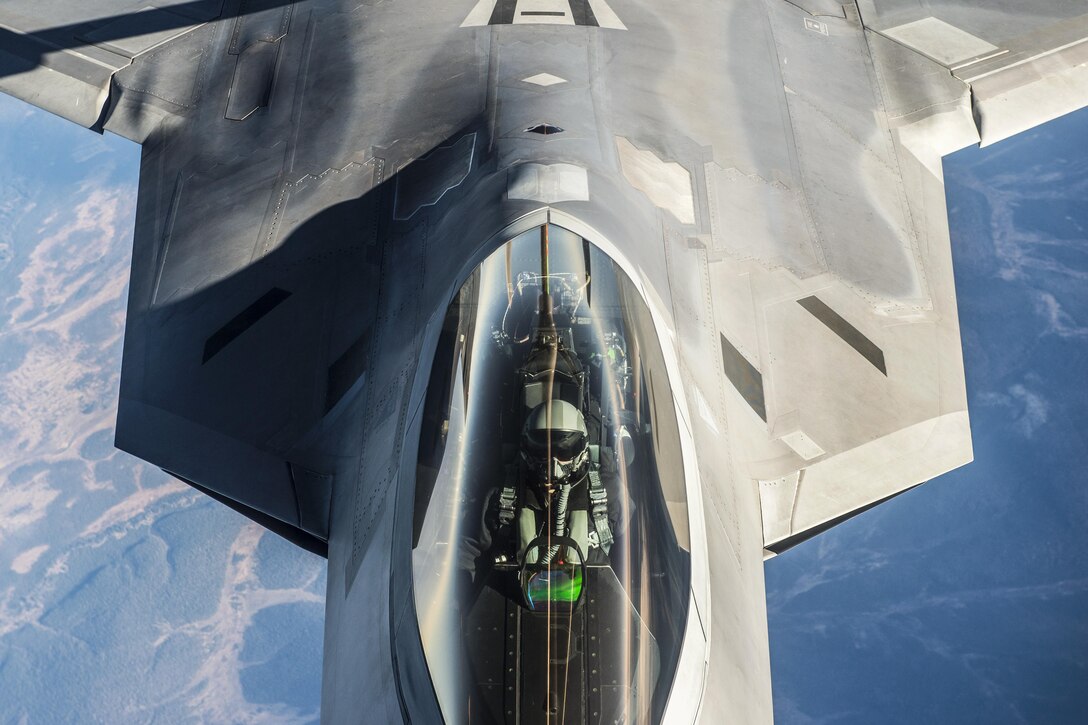 An Air Force F-22 Raptor receives fuel from a KC-135 Stratotanker while both units participate in Vigilant Shield 2017, a field training exercise, in the high Arctic, Oct. 18, 2016. The North American Aerospace Defense Command sponsored the annual exercise to improve operational capability in a binational environment. The Raptor is assigned to Joint Base Elmendorf-Richardson, Alaska. Pilots from the 92nd Aerial Refueling Squadron, assigned to Fairchild Air Force Base, Wash., flew the Stratotanker. Air Force photo by Tech. Sgt. Gregory Brook
