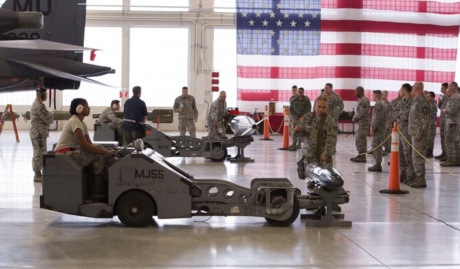 391st and 389th Aircraft Maintenance Unit load crews guide their munitions lift trucks to pick up their training munitions during a load competition Oct. 14, 2016, at Mountain Home Air Force Base, Idaho. The vehicle is an integral part of the loading process as some munitions can weigh several hundred pounds. (U.S. Air Force photo by Airman Jeremy D. Wolff/Released)  