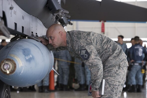 Master Sgt. Adam Zakrzewski, 366th Maintenance Group load standardization crew memeber, inspects a load on a 428th Aircraft Maintenance Unit's F-15E Strike Eagle during a load competition Oct. 14, 2016, at Mountain Home Air Force Base, Idaho. While the main focus of the competition is the loading, teams are also graded on dress and appearance and a written test. (U.S. Air Force photo by Airman Jeremy D. Wolff/Released)