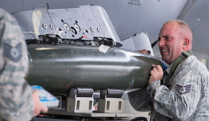 Staff Sgt. Dylan J. Peterson, 391st Aircraft Maintenance Unit weapons load crew team chief, secures a training munition to his team's F-15E Strike Eagle during a load competition Oct. 14, 2016, at Mountain Home Air Force Base, Idaho. Each squadron chooses their best three airmen to participate in this quarterly event. (U.S. Air Force photo by Airman Jeremy D. Wolff/Released)