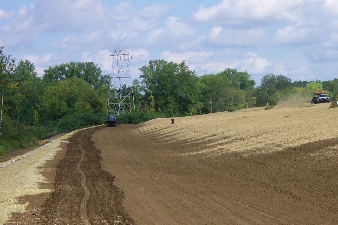 Contractors seed the soil cover at the former Lockbourne landfill, Columbus, Ohio, in August 2016.