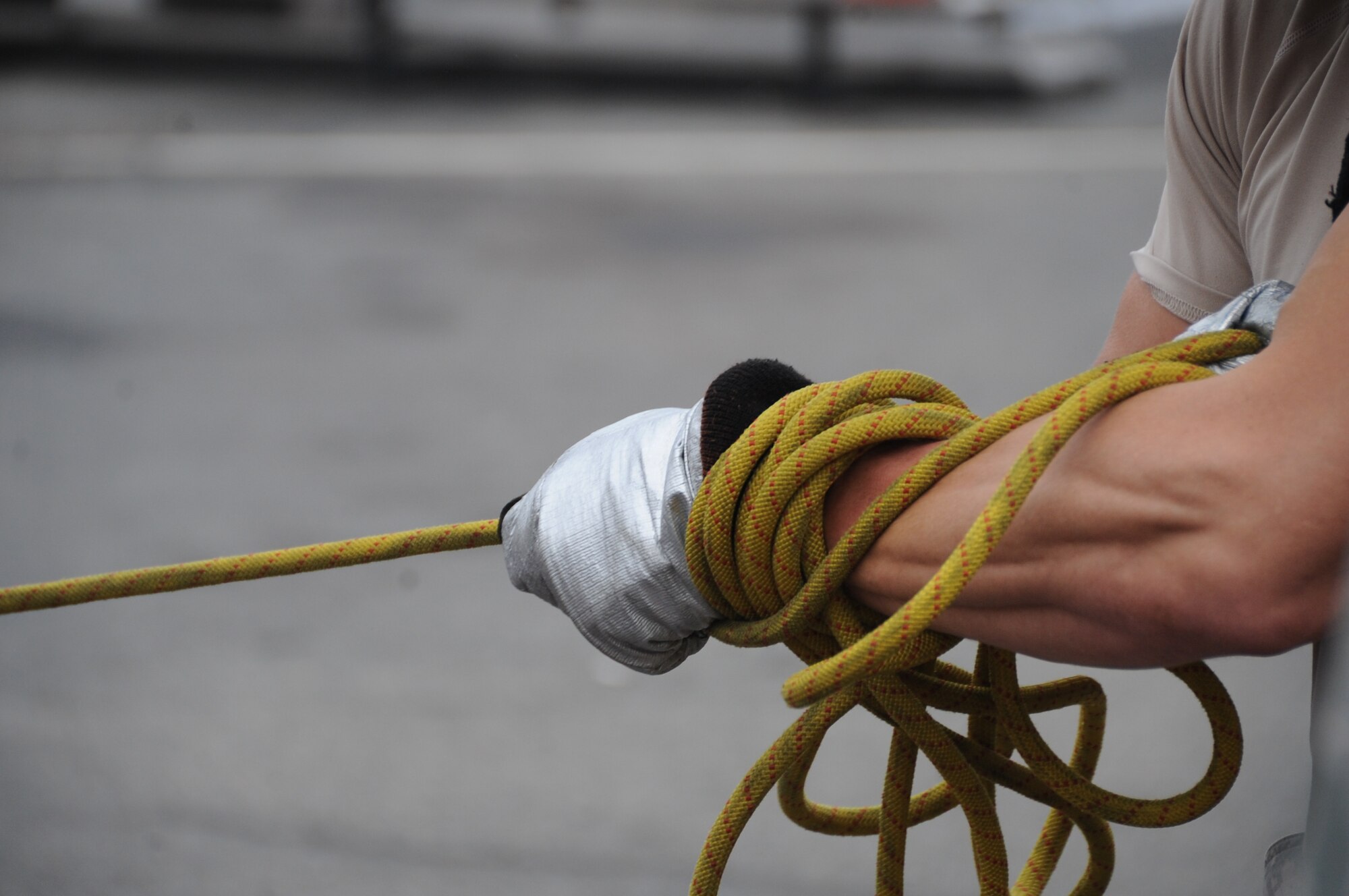 An Airman participates in the sled drag challenge during the fire muster competition at Barksdale Air Force Base, La., Oct. 13, 2016. Teams of Airmen participated in the hotel pack, sled drag, Keiser Sled, dummy drag and hose pull challenges. The obstacles allowed competitors to experience different on-the-job skills firefighters require. (U.S. Air Force photo/Airman Alexis C. Schultz)