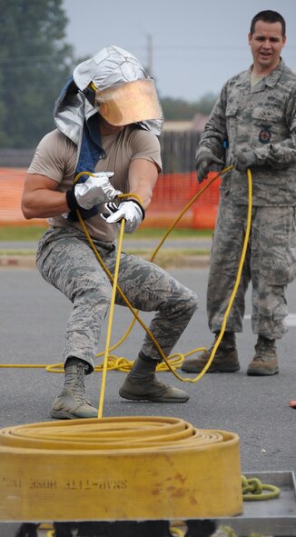 An Airman participates in the sled drag challenge during the fire muster competition at Barksdale Air Force Base, La., Oct. 13, 2016. Each team of Airmen participated in the hotel pack, sled drag, Keiser Sled, dummy drag and hose pull. The obstacles allowed competitors to experience different challenges on-the-job firefighters require. (U.S. Air Force photo/Airman Alexis C. Schultz)