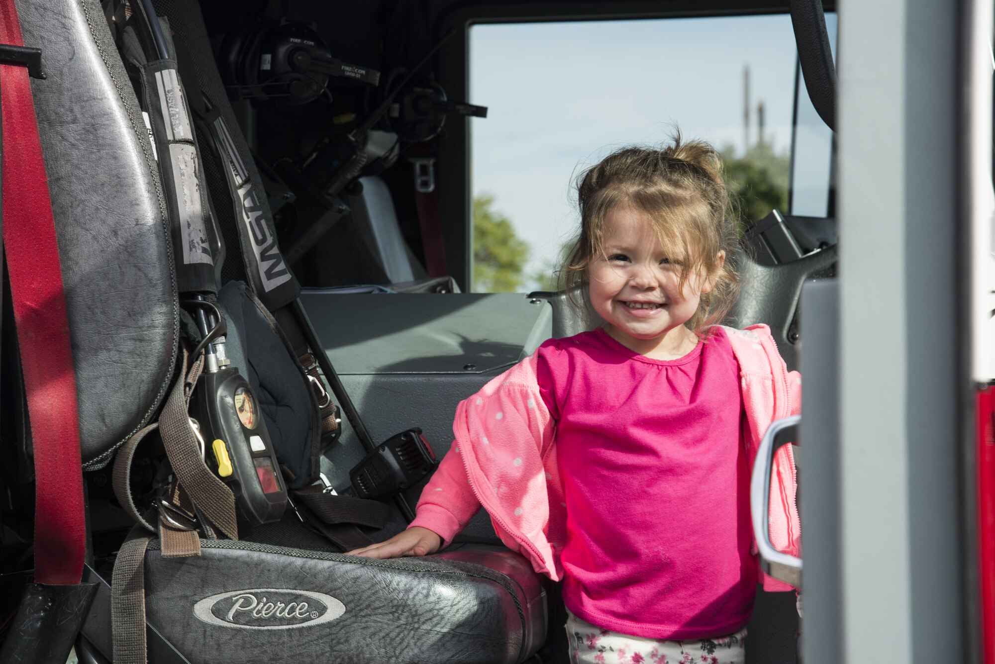 A child smiles for a photo, during fire prevention week, October 14, 2016 at the Child Development Center. Fire prevention week helps not only teaches children about preventing fires but also what steps to take in the event of a fire. (U.S. Air Force photo by Airman Gwendalyn Smith)