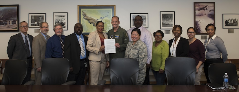 Joint Base Andrews Labor-Management Forum team pose after the signing of a Labor-Management Forum Charter Oct. 11, 2016. The charter was signed to signify the establishment of a cooperative and productive forum between labor and management relations by discussing workplace challenges on a regular basis. (U.S. Air Force photo by Senior Airman Philip Bryant)