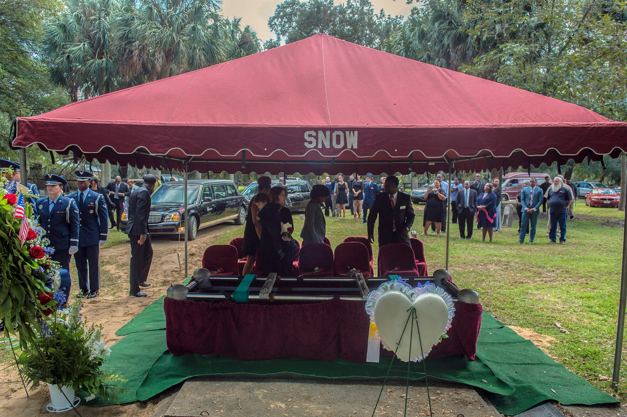 Family, loved ones, and service members gather in remembrance of deceased Staff Sgt. Darryl Smith, during his funeral Oct. 17, 2016, in Sparr, Fla. Moody’s  Honor Guard rendered memorial honors as Senior Airman Jasmine Smith, 23d Equipment Maintenance Squadron HC-130J Combat King II aerospace propulsion apprentice, mourned the loss of her brother. (U.S. Air Force photo by Airman 1st Class Greg Nash)