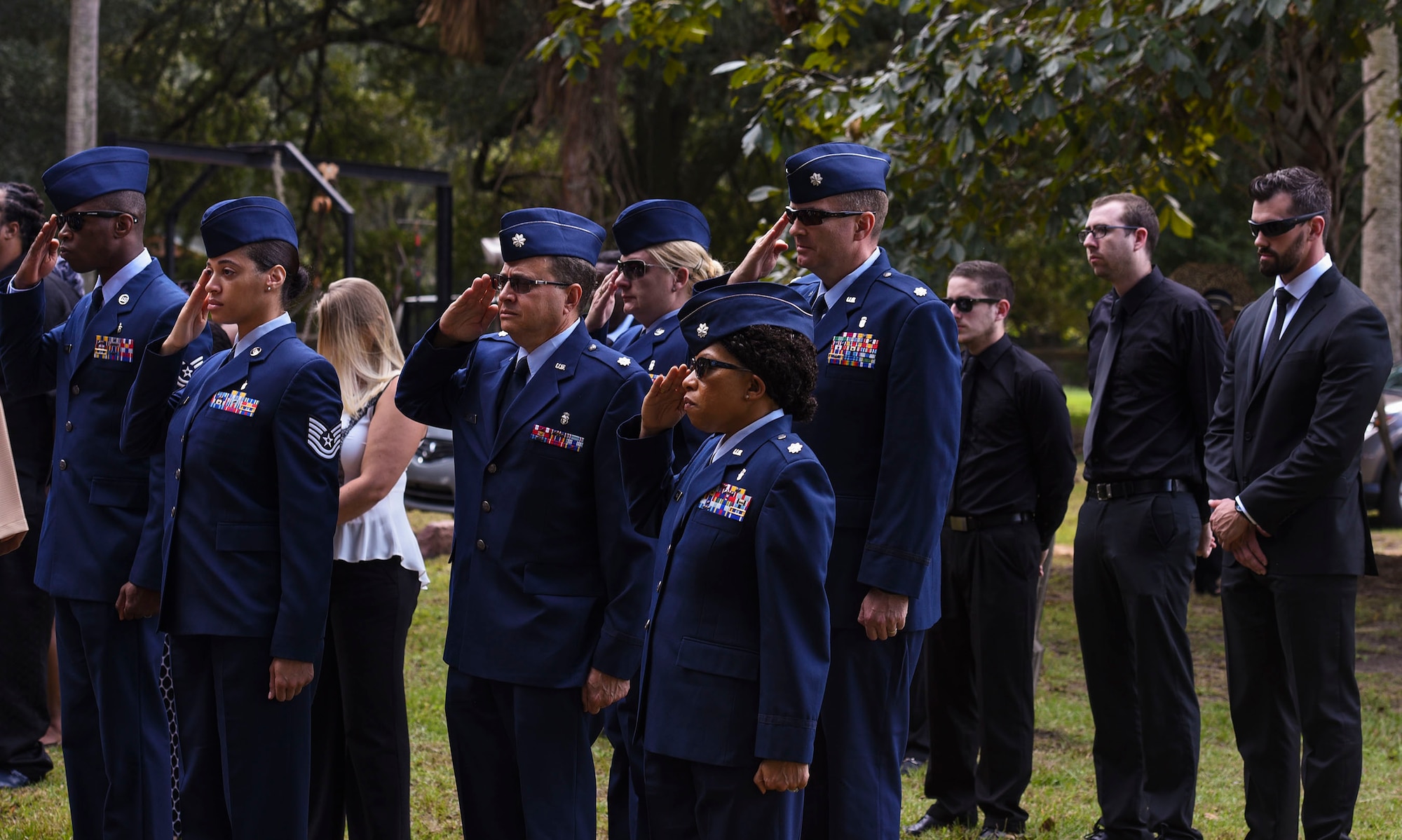 Friends from Elmendorf Air Force Base, Alaska and Whiteman Air Force Base, Mo., render salutes during a funeral, Oct. 17, 2016, in Sparr, Fla.  The funeral was in honor of Staff Sgt. Darryl Smith, who was a laboratory technician stationed at Elmendorf AFB from 2012-2015 and finished his career at Whiteman AFB. (U.S. Air Force photo by Airman 1st Class Greg Nash)