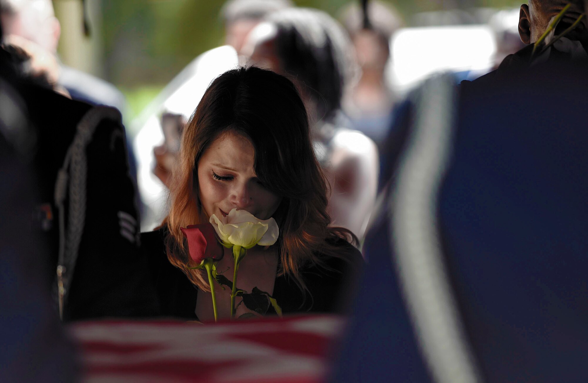 Albessa Smith, widow of the late Staff Sgt. Darryl Smith, 509th Medical Support Squadron laboratory technician, Whiteman Air Force Base, Mo., mourns the loss of her husband during his funeral, Oct. 17, 2016, in Sparr, Fla. Smith says she cherishes their five years of being new, active-duty Airmen to making E-4, being first-time parents, and seeing Darryl promote to E-5 and receiving the John L. Levitow award in Airman Leadership School. She cherishes all memories of him, especially the ones where he smiled brightly. (U.S. Air Force photo by Airman 1st Class Greg Nash)