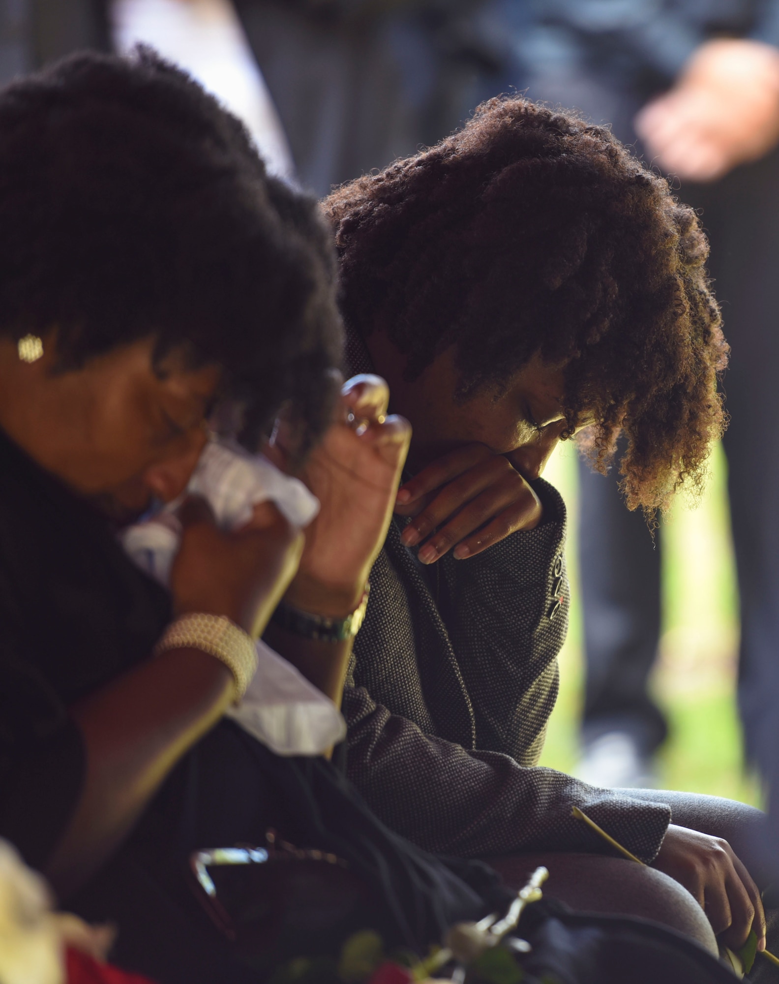 Toni Smith, front, and her step-daughter, Senior Airman Jasmine Smith, 23d Equipment Maintenance Squadron HC-130 Combat King II aerospace propulsion journeyman, mourn the loss of Staff Sgt. Darryl Smith, 509th Medical Support Squadron laboratory technician, Whiteman Air Force Base, Mo., Oct. 17, 2016, in Sparr, Fla. “My brother and I were practically twins,” said SrA Smith. “I loved him more than I ever loved anyone or anything on this Earth, and I still do.” (U.S. Air Force photo by Airman 1st Class Greg Nash)