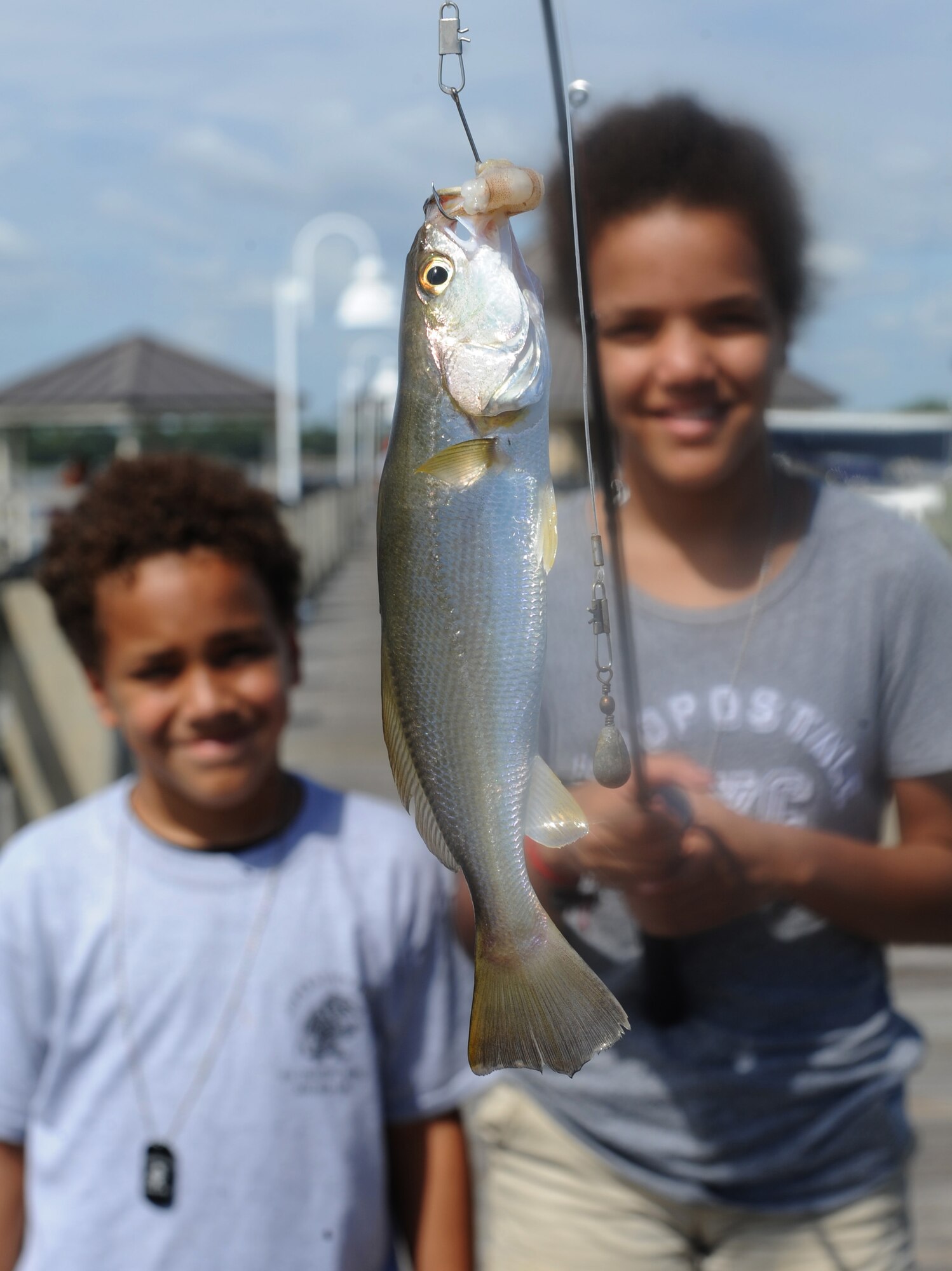 Keith and Olivia Mosley, children of 1st Lt. Desiree Mosley, 81st Medical Operations Squadron emergency room nurse, showcase a fish they caught during the Kids’ Fishing Rodeo at the marina Oct. 15, 2016, on Keesler Air Force Base, Miss. Over 90 participants attended the event where prizes were awarded for different categories and free food was available. (U.S. Air Force photo by Kemberly Groue/Released)