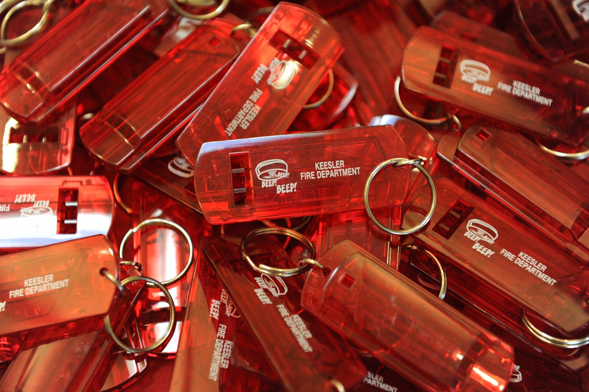 Key chain whistles sit on display during Fire Prevention Week at the Base Exchange Oct. 11, 2016, on Keesler Air Force Base, Miss. The week-long event included fire drills, literature hand-outs and stove fire demonstrations around the base and concluded with an open house at the fire department. (U.S. Air Force photo by Kemberly Groue/Released)
