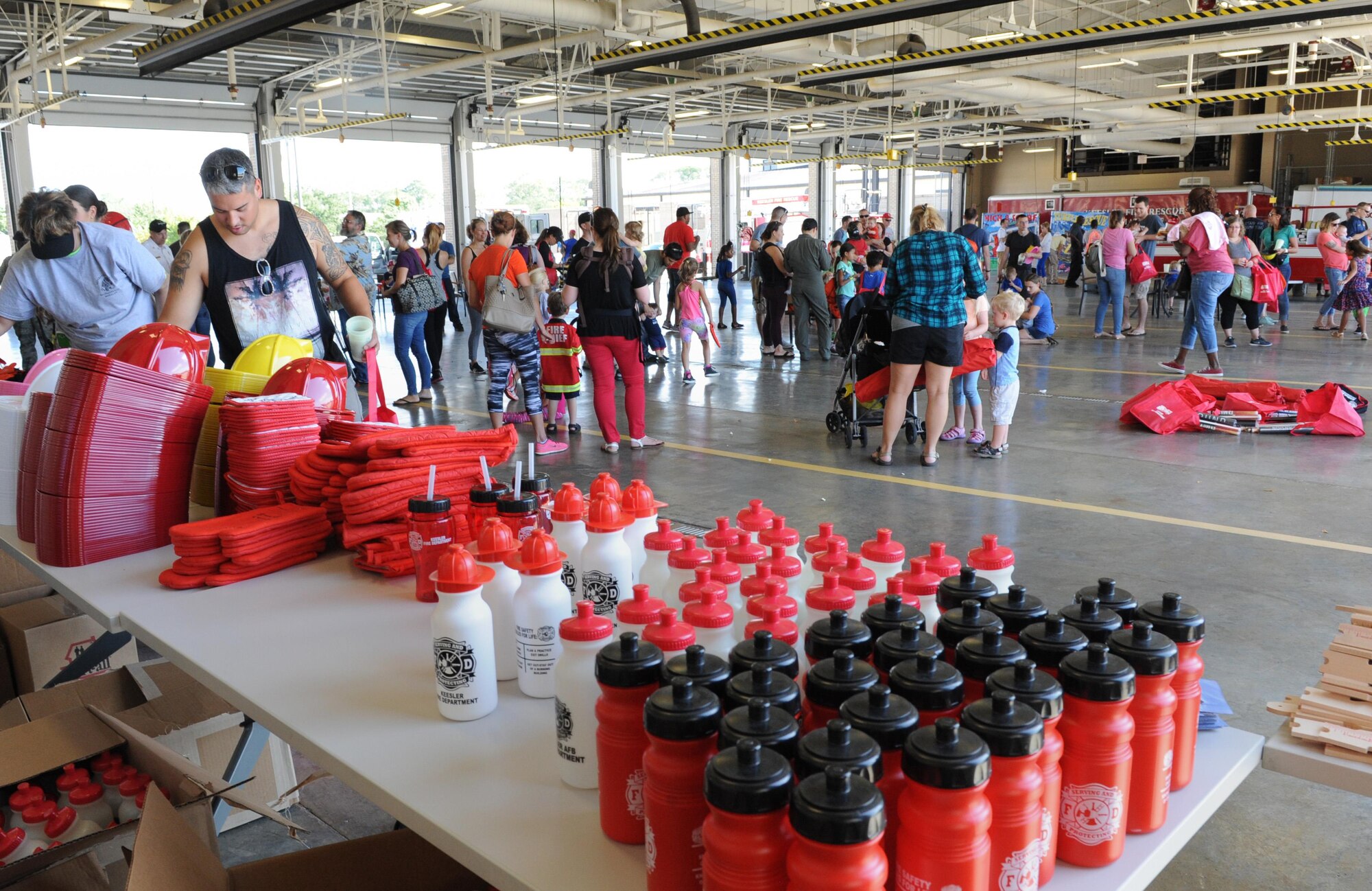 Keesler families attend the Fire Prevention Week open house at the Keesler Fire Department Oct. 15, 2016, on Keesler Air Force Base, Miss. Throughout the week the Keesler Fire Department conducted fire drills, toured various facilities with Sparky the Fire Dog, passed out fire safety information and fire hats for children and provided stove and fire extinguisher demonstrations. (U.S. Air Force photo by Kemberly Groue/Released)