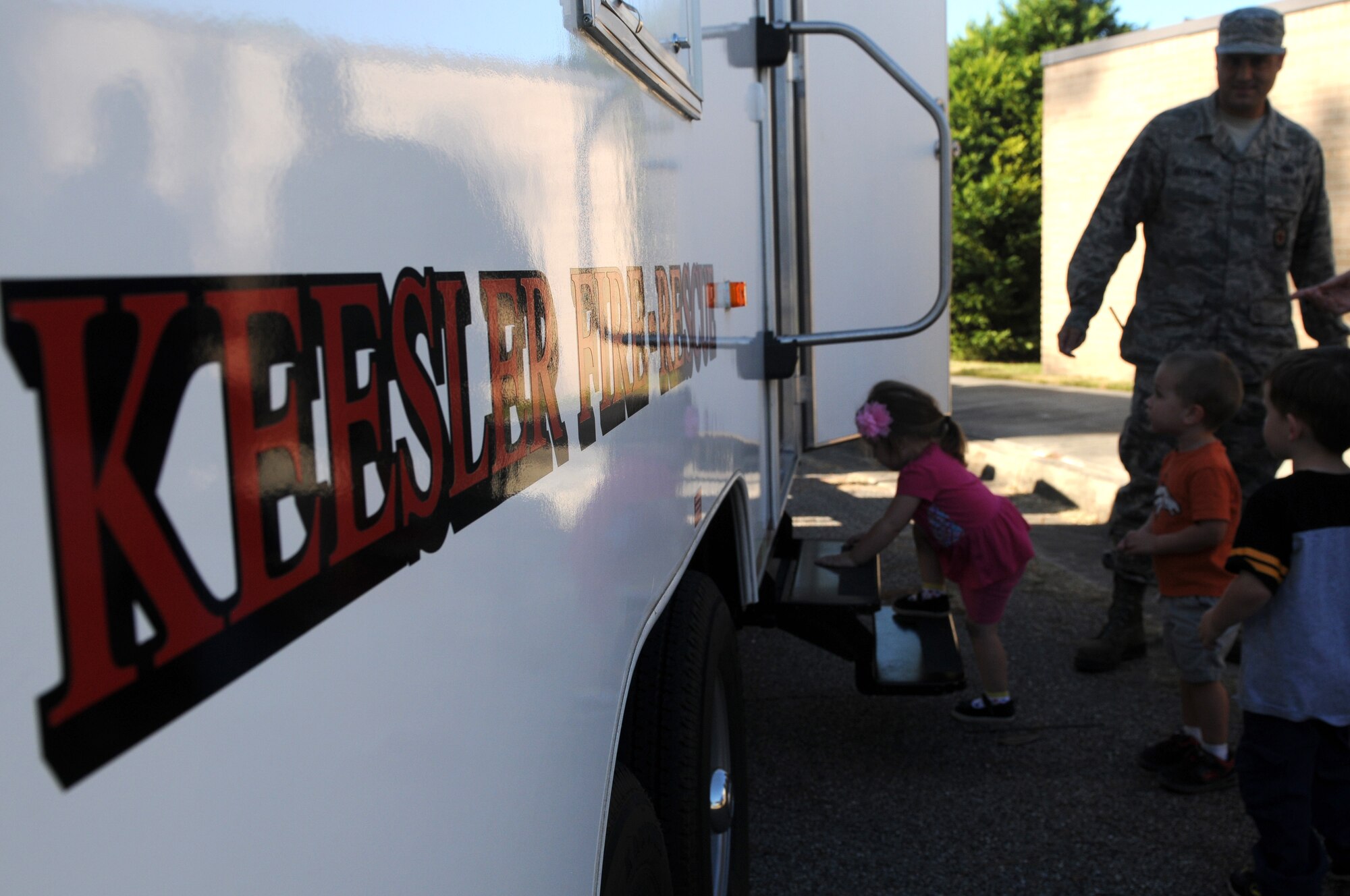 Keesler Child Development Center children enter a smoke house trailer during a Fire Prevention Week demonstration at the CDC Oct. 12, 2016, on Keesler Air Force Base, Miss. The week-long event included fire drills, literature hand-outs and stove fire demonstrations around the base and concluded with an open house at the fire department. (U.S. Air Force photo by Senior Airman Holly Mansfield/Released)