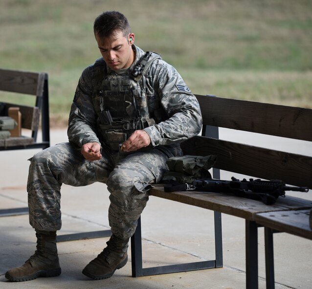Senior Airman Matthew Schaffer, 2nd Security Forces Squadron installation patrolman, loads magazines for his M4 carbine at Barksdale Air Force Base, La., Oct. 17, 2016. The M4 uses 5.56x45 mm ammunition and has an effective point target range of 500 meters and an effective area target range of 600 meters. (U.S. Air Force photo/Airman 1st Class Stuart Bright)