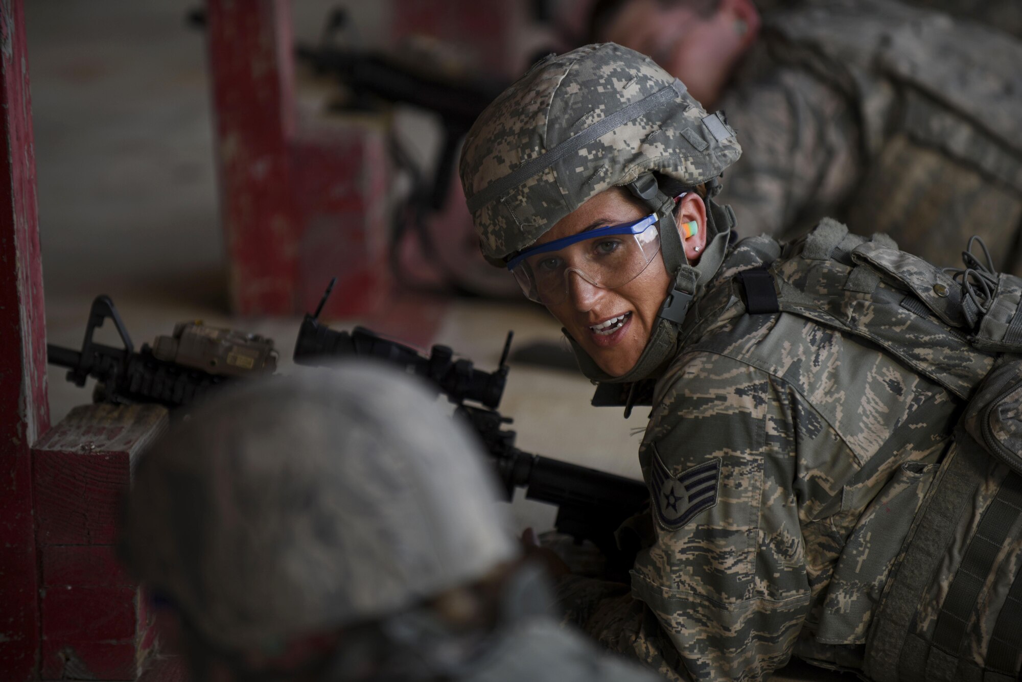 SSgt Morgan Petty, Office of Special Investigations liaison for sexual assault investigator, is ready to qualify for her M4 carbine at Barksdale Air Force Base, La., Oct. 17, 2016. Six months between each annual qualification Security Forces Airmen do a shoot, move and communicate fire to train with their weapons. (U.S. Air Force photo/Airman 1st Class Stuart Bright)