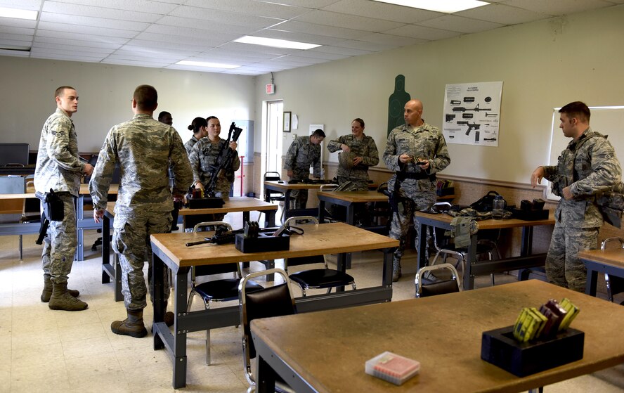 Members of the 2nd Security Forces Squadron prepare to head to the firing range for the M9 Berretta and M4 Air Force Qualification Course at Barksdale Air Force Base, La., Oct. 17, 2016. Security Forces Airmen need to recertify every year to carry the M9 Berretta and the M4 carbine to stay proficient due to having to carry them while on patrol. (U.S. Air Force photo/Airman 1st Class Stuart Bright)