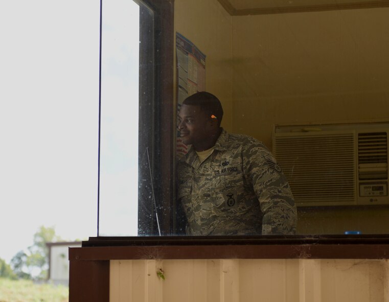 Staff Sgt. Justin Stanley, 2nd Security Forces Squadron combat arms instructor, observes as members of the SFS prepare to qualify on the M9 Berretta at Barksdale Air Force Base, La., Oct. 17, 2016. Security Forces Airmen can, but, are not required to qualify for the 240B Machine gun and M249 Saw, depending on their base needs. (U.S. Air Force photo/Airman 1st Class Stuart Bright)