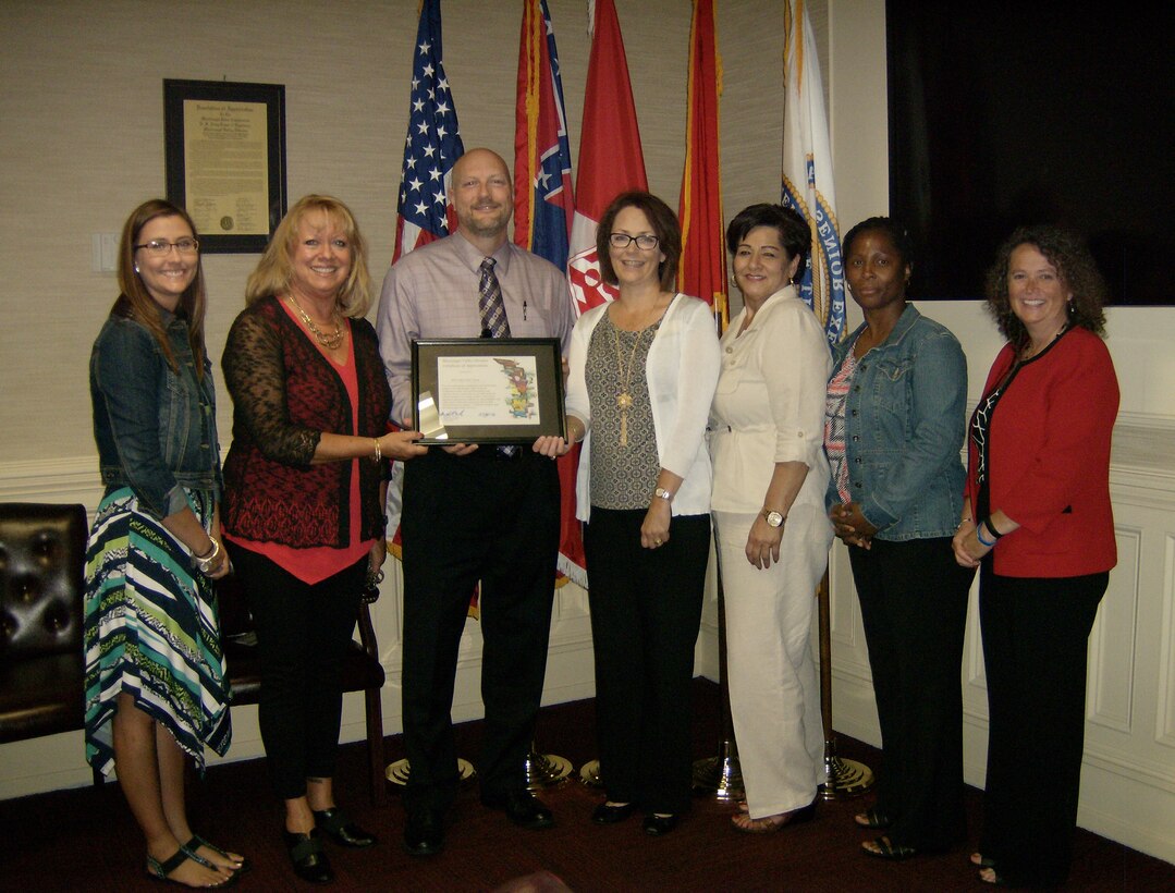 Members of the Vicksburg Civilian Personnel Advisory Center visited the Division in September.  They attended a meet and greet with the MVD staff held in honor of specialists who serviced MVD the last fiscal year.  The team received a certificate of appreciation on behalf of Major General Michael Wehr and Chief of MVD Regional Readiness and Contingency Operations, Jared Gartman. The team is recognized for their unwavering support and outstanding contributions. Pictured left to right are  HR Specialist Ashley Clifford, Vicksburg CPAC Chief Kathy Tober, RCO Chief Jared Gartman, HR Specialist Robin Hougham, HR Specialist Alma Perez, HR Specialist Patricia Gordan, and Supervisory HR Specialist, Amy Miller.