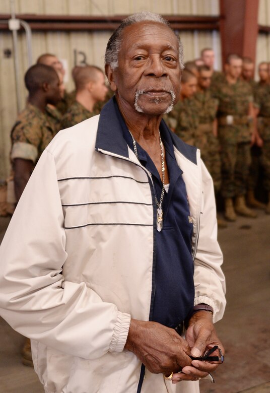Montford Point Marine Henry L. Jackson possess in front of recruits from Marine Corps Recruit Depot Parris Island, S. C., as they conduct combat care aboard Marine Corps Logistics Base Albany, Oct. 11. More than 6,000 recruits and permanent personnel sought shelter aboard the installation, Oct. 5-11.