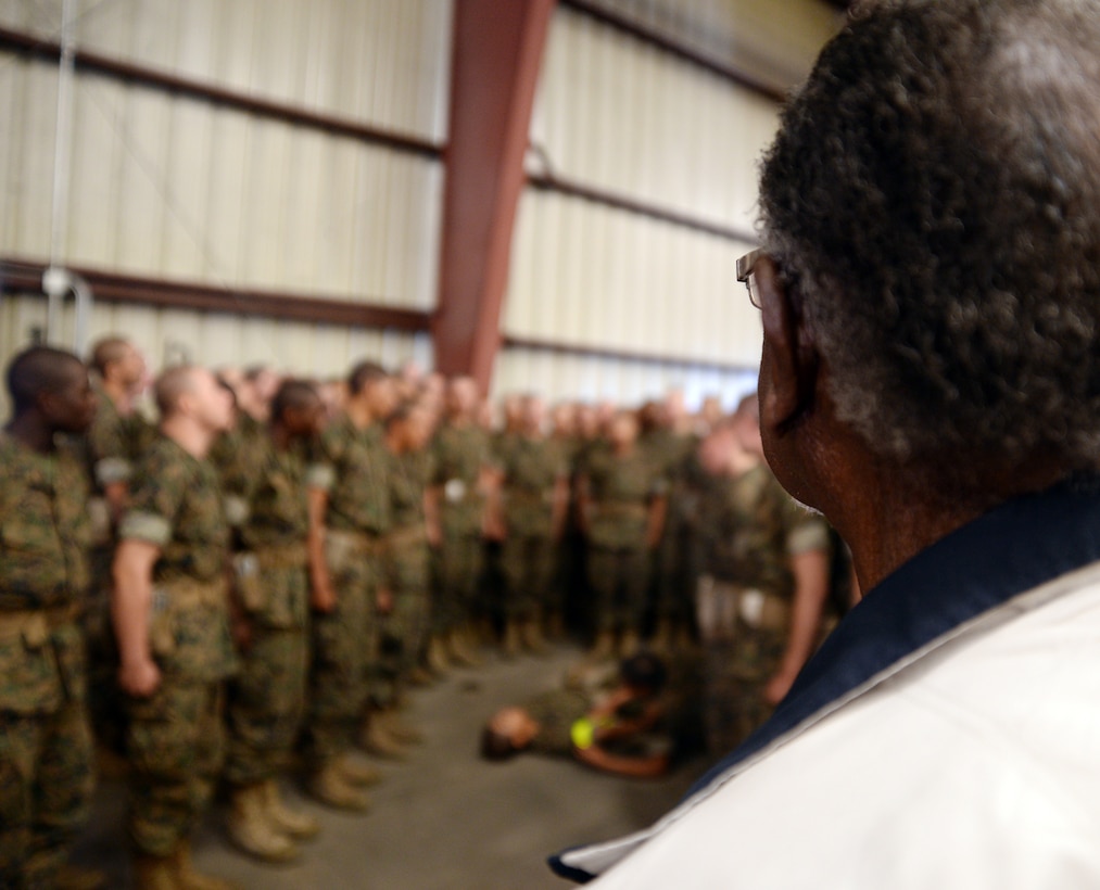 Montford Point Marine Henry L. Jackson observes recruits from Marine Corps Recruit Depot Parris Island, S. C., as they conduct combat care aboard Marine Corps Logistics Base Albany, Oct. 11. More than 6,000 recruits and permanent personnel sought shelter aboard the installation, Oct. 5-11.