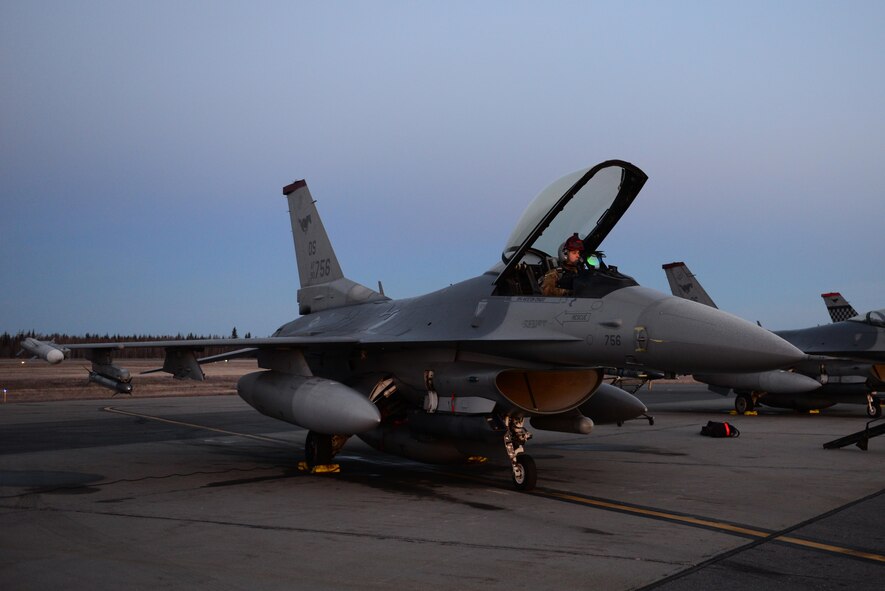 U.S. Air Force Capt. Brent Smith, a pilot assigned to the 36th Fighter Squadron, Osan Air Base, Republic of Korea, prepares an F-16 Fighting Falcon aircraft for takeoff Oct. 19, 2016, during RED FLAG-Alaska (RF-A) 17-1, at Eielson Air Force Base, Alaska. RF-A enables joint and international units to sharpen their combat skills by flying simulated combat sorties in a realistic threat environment, which allows them to exchange tactics, techniques and procedures while improving interoperability. (U.S. Air Force photo by Airman 1st Class Cassandra Whitman)