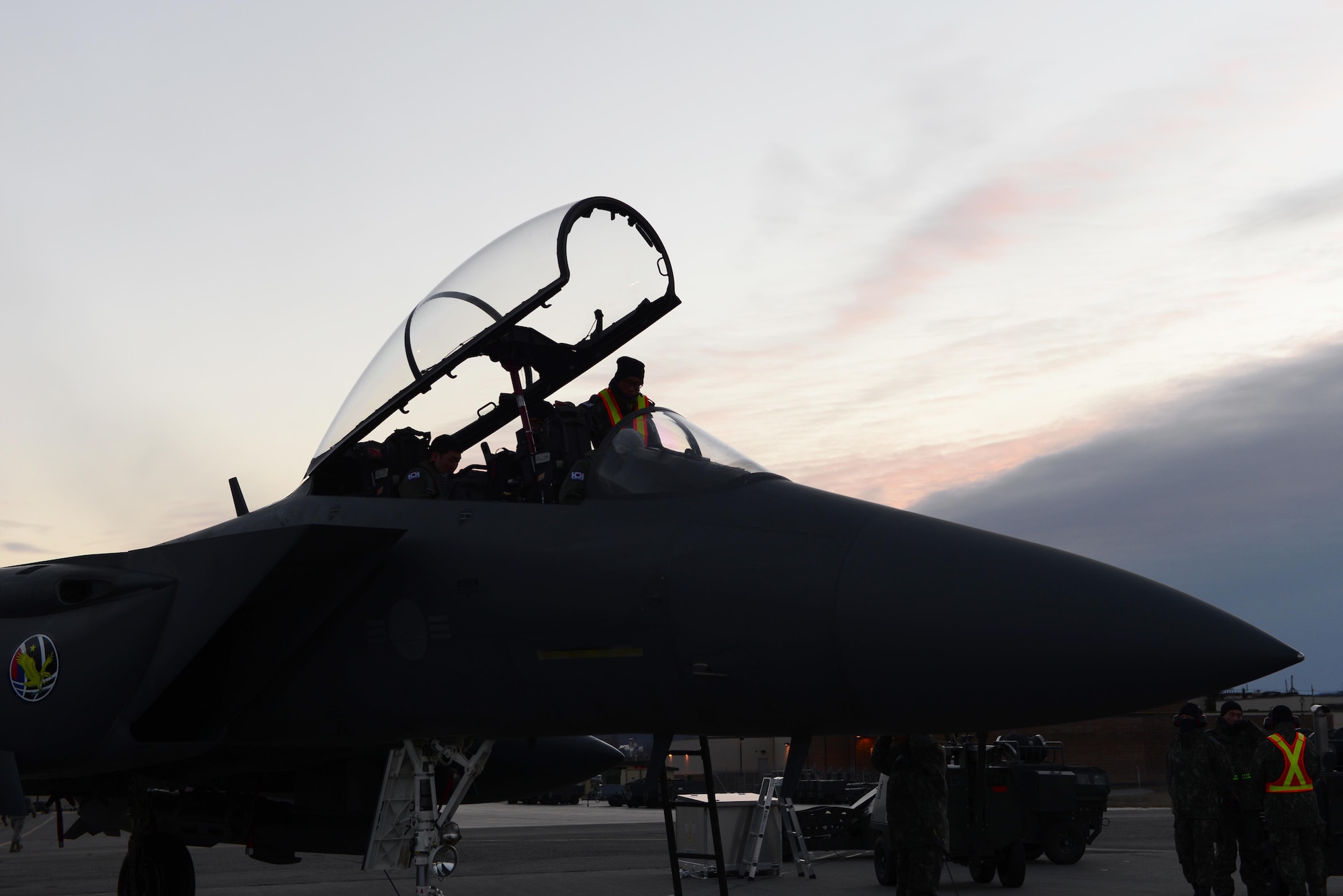 A maintenance airman with the Republic of Korea Air Force prepares the cockpit of an F-15K Slam Eagle fighter aircraft Oct. 18, 2016, during RED FLAG-Alaska (RF-A) 17-1, at Eielson Air Force Base, Alaska. RF-A provides training for deployed maintenance and support personnel in sustainment of large-force air operations. (U.S. Air Force photo by Airman 1st Class Cassandra Whitman)
