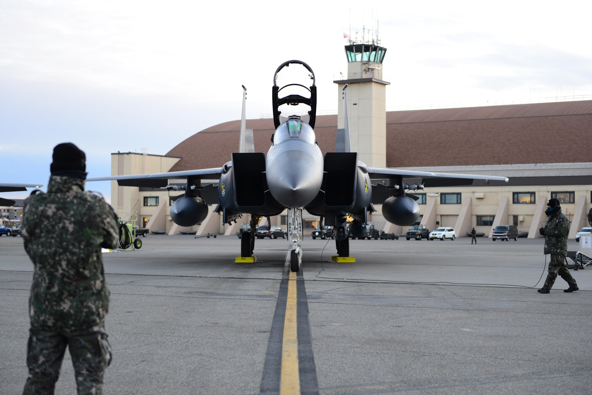 Two pilots with the Republic of Korea Air Force (ROKAF) prepare an F-15K Slam Eagle fighter aircraft for a morning sortie while two maintenance airmen with the ROKAF prepare the pilots to taxi Oct. 18, 2016, during RED FLAG-Alaska (RF-A) 17-1, at Eielson Air Force Base, Alaska. RF-A enables joint and international units to sharpen their combat skills by flying simulated combat sorties in a realistic threat environment, allowing them to exchange tactics, techniques and procedures while improving interoperability. (U.S. Air Force photo by Airman 1st Class Cassandra Whitman)
