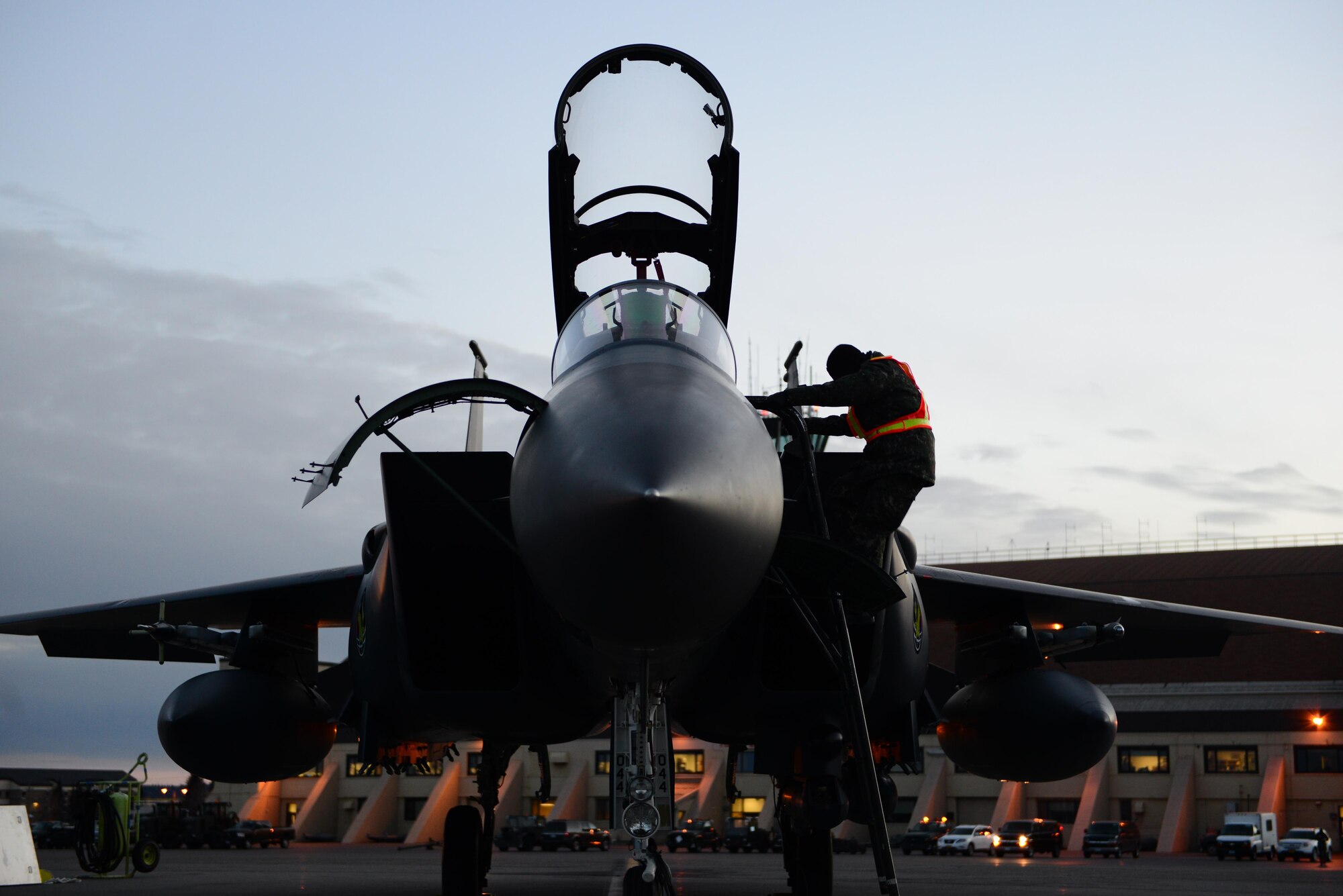A maintenance airman with the Republic of Korea Air Force descends the ladder on an F-15K Slam Eagle fighter aircraft while preparing the cockpit for the pilot Oct. 18, 2016, during RED FLAG-Alaska (RF-A) 17-1 at Eielson Air Force Base, Alaska. RF-A exercises are vital to maintaining peace and stability in the Pacific region. (U.S. Air Force photo by Airman 1st Class Cassandra Whitman)
